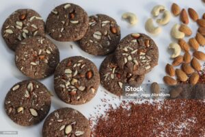 Ragi Cookies or Finger Millet Cookies. Delight in wholesome goodness with these delectable finger millet cookies topped with almonds and cashews. A nutritious treat for health conscious food lovers.